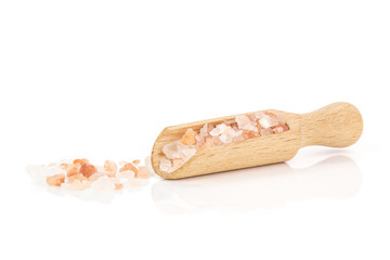 Lot of pieces of pink himalayan salt crystals in a scoop isolated on white background