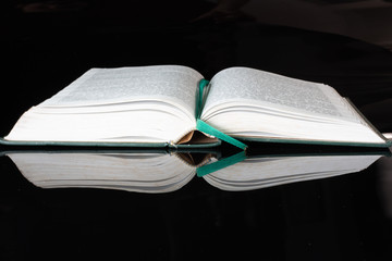 open book isolated on black background