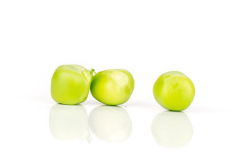 Closeup of three whole green sugar snap pea isolated on white background