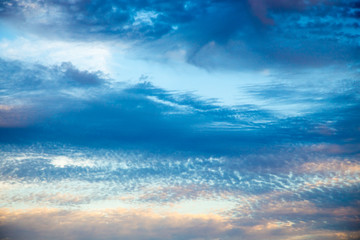 Obraz premium Bright blue sky with gentle cumulus clouds. Pink vanilla heaven. Natural summer and spring background.