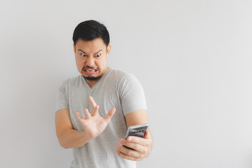 Man feels hate and disgusted with what show on the smartphone.