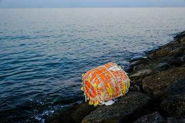 Vintage stuffed buoy washed off to the shore