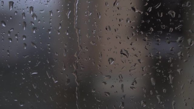 Autumn, rain, raindrops on the dark window.