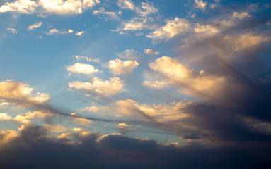 Fototapeta premium Bright blue sky with gentle cumulus clouds. Pink vanilla heaven. Natural summer and spring background.