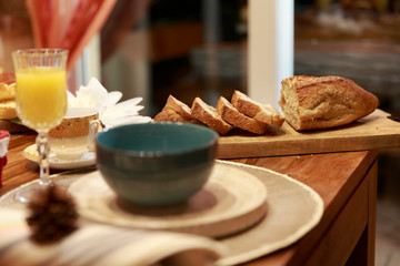 Sliced bread with cup and plate in breakfast room