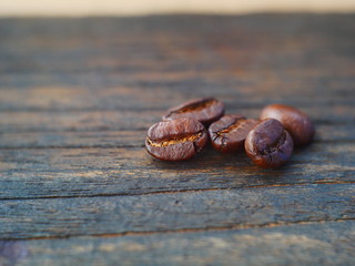 organic coffee beans on wood background,concept coffee product
