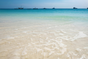 Ships and boats on horizon near coast of Zanzibar island