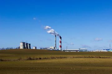 Fototapeta na wymiar Coal processing plant. smoke of pipes pollutes atmosphere of the city. Ecology. smoke emission