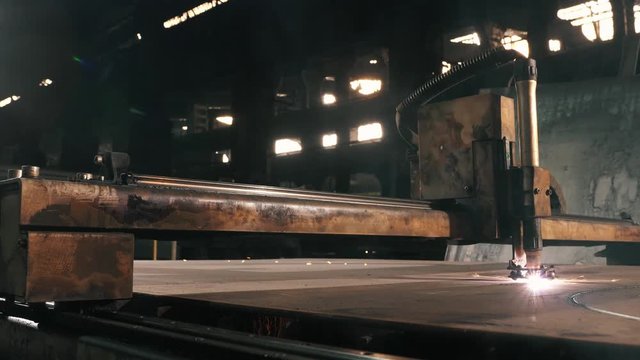 Metal Cutting Machine Cuts Round Parts On A Sheet Of Metal