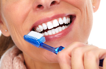 Woman teeth with toothbrush.