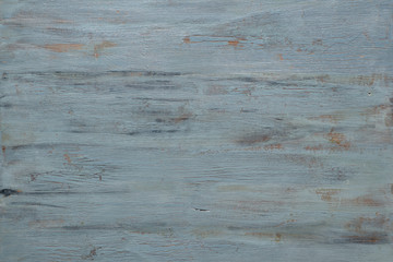 Light grey-bluish wooden texture with crackled paint. Aged grunge surface, copy-space