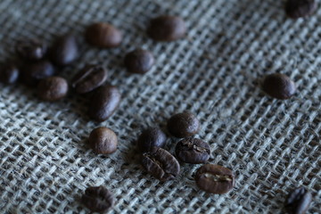 Scattered Coffee Beans On Burlap
