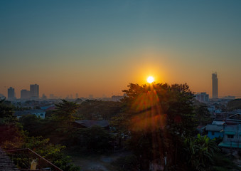 The beautiful sunrise panorama view of a small town with clear sky from the window