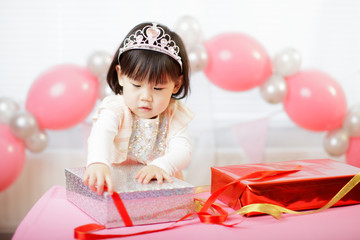 toddler girl celebrating her third birthday at home