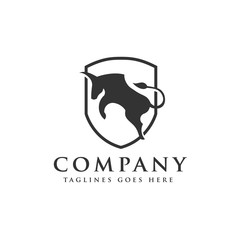 Fototapeta premium bull jump or angry bull with shield logo vector concept