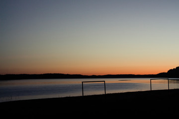 Fototapeta na wymiar football goal at sunset