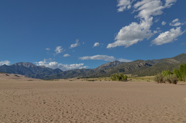 sand dunes and Sangre de Cristo Range scenic view from dry Medano Creek (Saguache county, Colorado, USA)