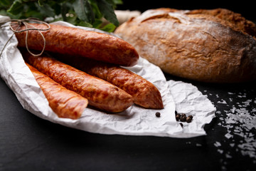 sausage. A portion of rural sausage on a chopping board.