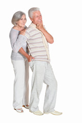 Portrait of beautiful senior couple posing on white background