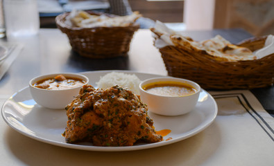 Chicken tikka masala, delicious Indian dish with naan bread.
