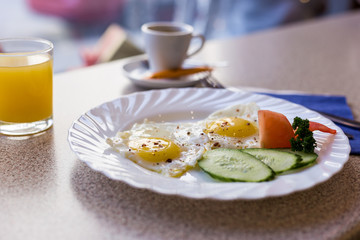 eggs with sausages and cheese and vegetables for breakfast