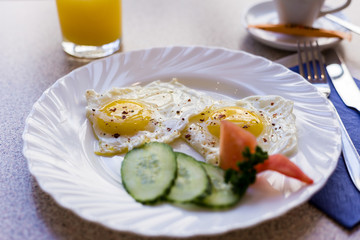 eggs with sausages and cheese and vegetables for breakfast