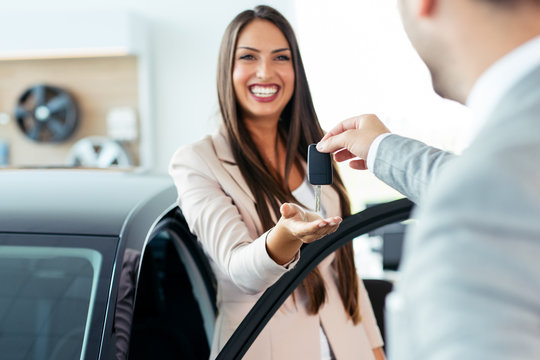 Young Woman Buying Her First Brand New Car