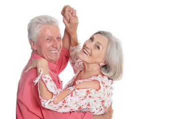 Happy senior couple dancing isolated on white background