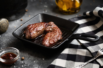 Grilled meat Steak Machete with salt and pepper on slate board black background
