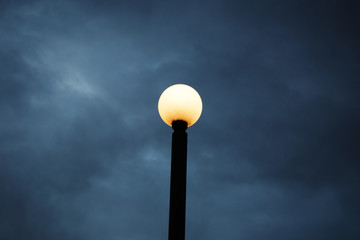 Fototapeta na wymiar Street lamp against a dark blue sky.