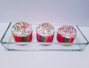 ussian Easter delicious bakery. Mini cupcakes in glass plate.