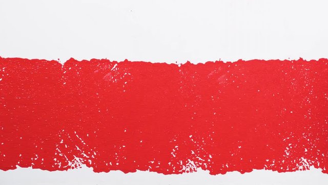 red color over white wall. hand painting on the wall