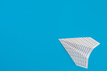 paper airplane on a blue background