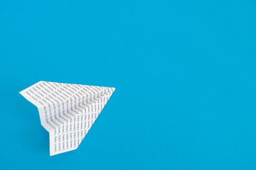 paper airplane on a blue background