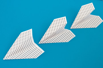 paper airplane on a blue background
