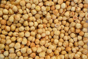 Texture of shelled hazelnuts in flat lay angle.