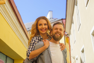 Young loving couple have dating outdoor. Man and woman walking in a city streets. Love, relations and date concept.