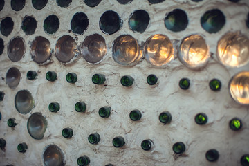 Glass bottles inside the wall background, abstract texture