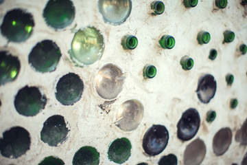 Glass bottles inside the wall background, abstract texture