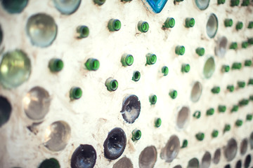 Glass bottles inside the wall background, abstract texture