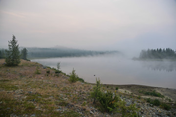 Misty morning on the taiga river.