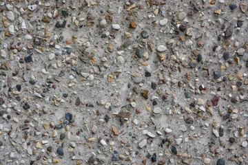 The texture of the concrete wall.