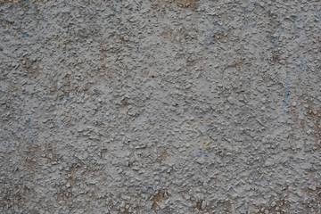The texture of the concrete wall.