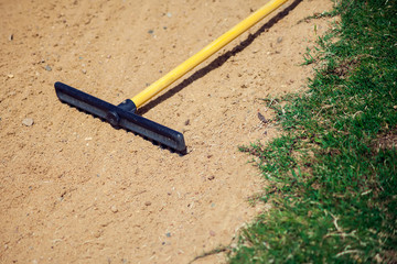 Sand rake equipment on the golf field.