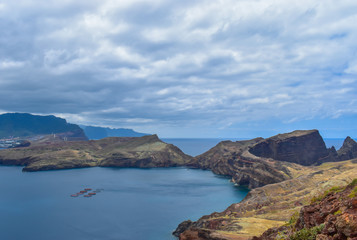 Fototapeta na wymiar Steep cliffs in Madeira and the Atlantic Ocean. Taken at St. Lawrence Peninsula