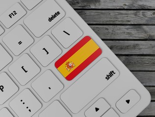 Spain flag enter key on white keyboard, on wood background. 3d render