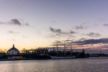 Fototapeta premium An old white sailing ship in Stockholm during a colorful sunrise - 1