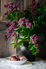 traditional decorated polish Easter eggs and lilac flowers