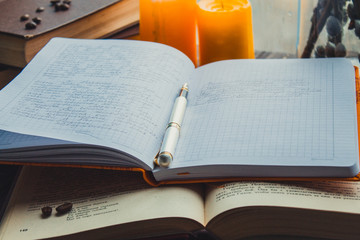  books coffee candles on the table