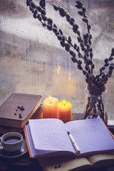  books coffee candles on the table